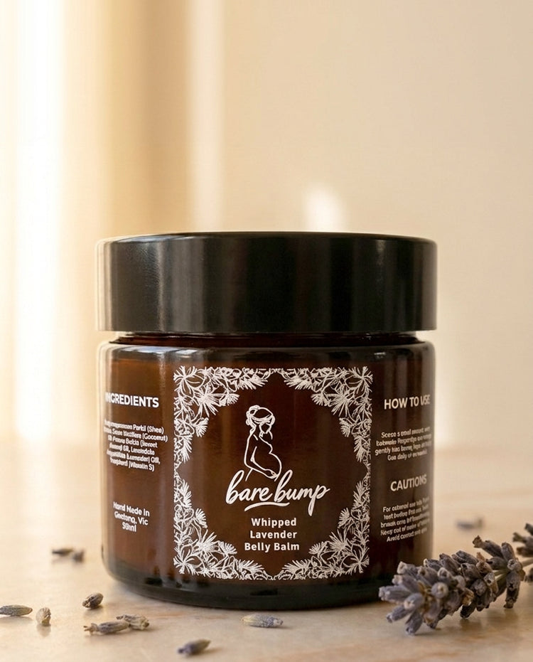 Whipped Belly Balm in a wide-mouth amber jar with a black lid